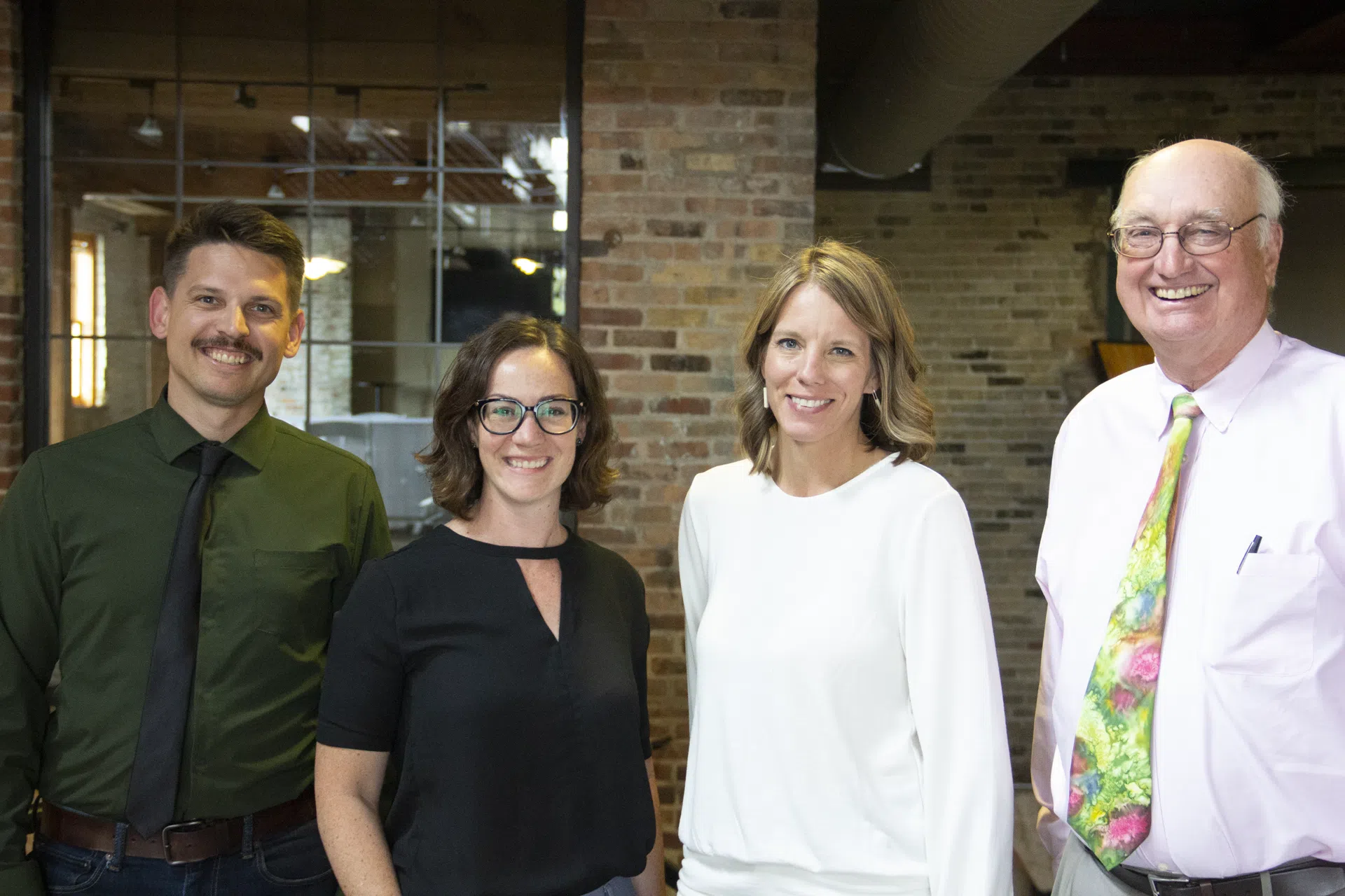 Image of Studio GWA Partners taking professional photo, brick background